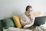 Girl doing an online class in bed Girl doing an online class in bed