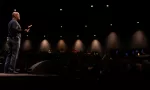 Pastor preaching to large auditorium Pastors supporting pastors to avoid burnout